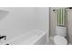 The bathroom features a white tiled tub and modern fixtures at 25 Cotton Fields Ln # 29, Fuquay Varina, NC 27526