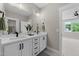 Bathroom with dual sinks, a large mirror, and modern fixtures, with tile flooring at 25 Cotton Fields Ln # 29, Fuquay Varina, NC 27526