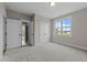 The bedroom has carpet flooring and has a large window, which allows for great natural light at 25 Cotton Fields Ln # 29, Fuquay Varina, NC 27526