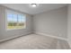 Spacious bedroom with carpeting, large window, and neutral walls at 25 Cotton Fields Ln # 29, Fuquay Varina, NC 27526