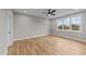 Bright bedroom with wood flooring, large window, and ceiling fan at 25 Cotton Fields Ln # 29, Fuquay Varina, NC 27526