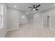 Large bedroom with wood flooring, ceiling fan, and access to bathroom at 25 Cotton Fields Ln # 29, Fuquay Varina, NC 27526