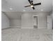 Spacious bonus room features neutral colors, plush carpet and a modern ceiling fan with lights at 25 Cotton Fields Ln # 29, Fuquay Varina, NC 27526