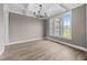 Bright dining room with coffered ceilings, chandelier, and large window at 25 Cotton Fields Ln # 29, Fuquay Varina, NC 27526