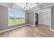 Dining room with hardwood floors, large windows, and access to entryway at 25 Cotton Fields Ln # 29, Fuquay Varina, NC 27526