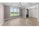 Sunlit dining area with stylish light fixture and view of entry at 25 Cotton Fields Ln # 29, Fuquay Varina, NC 27526