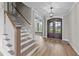 Elegant entryway with double doors, hardwood floors and staircase at 25 Cotton Fields Ln # 29, Fuquay Varina, NC 27526
