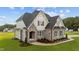 Two-story house with stone and siding, showcasing a welcoming entrance at 25 Cotton Fields Ln # 29, Fuquay Varina, NC 27526