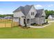 Newly built home boasting stone and neutral siding, a charming front yard, and lush landscaping at 25 Cotton Fields Ln # 29, Fuquay Varina, NC 27526