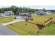 Beautiful home with a three-car garage, a screened-in porch, and a large fenced yard at 25 Cotton Fields Ln # 29, Fuquay Varina, NC 27526