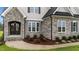 Close-up of the charming stone and gray exterior at 25 Cotton Fields Ln # 29, Fuquay Varina, NC 27526