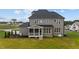 Two-story house exterior with screened porch at 25 Cotton Fields Ln # 29, Fuquay Varina, NC 27526