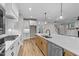 Bright kitchen with gas cooktop, white cabinets, and quartz countertops at 25 Cotton Fields Ln # 29, Fuquay Varina, NC 27526