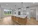 Spacious kitchen with island, stainless steel appliances, and white shaker cabinets at 25 Cotton Fields Ln # 29, Fuquay Varina, NC 27526