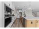 Kitchen with stainless steel appliances, island, and modern cabinets at 25 Cotton Fields Ln # 29, Fuquay Varina, NC 27526