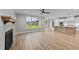 Open concept living room with kitchen and fireplace at 25 Cotton Fields Ln # 29, Fuquay Varina, NC 27526