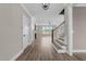 View of the hallway, stairs, and living room with fireplace and large window at 25 Cotton Fields Ln # 29, Fuquay Varina, NC 27526