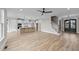 Open living space with kitchen, stairs, and hardwood floors at 25 Cotton Fields Ln # 29, Fuquay Varina, NC 27526