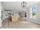 Bright open-concept space with kitchen island and lots of natural light at 25 Cotton Fields Ln # 29, Fuquay Varina, NC 27526