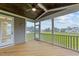 Relaxing screened porch with wooden deck and backyard view at 25 Cotton Fields Ln # 29, Fuquay Varina, NC 27526