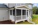 Screened porch with white railings and wooden steps at 25 Cotton Fields Ln # 29, Fuquay Varina, NC 27526