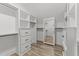 Organized walk-in closet with built-in shelves and drawers, providing ample storage at 25 Cotton Fields Ln # 29, Fuquay Varina, NC 27526