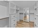 Spacious walk-in closet with built-in shelves and drawers at 25 Cotton Fields Ln # 29, Fuquay Varina, NC 27526