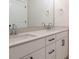 Bathroom featuring a double vanity with undermount sinks, modern fixtures and black hardware at 205 Wash Hollow Dr, Wendell, NC 27591