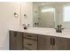 Bathroom with double sinks, granite counters, and glass-enclosed shower at 205 Wash Hollow Dr, Wendell, NC 27591