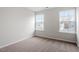 Neutral bedroom showcasing plush carpet and large windows at 9301 Kitchin Farms Way # 433, Wake Forest, NC 27587