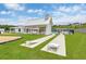 Inviting community area with a covered pavilion, swimming pool, and cornhole game setup for outdoor fun at 9301 Kitchin Farms Way # 433, Wake Forest, NC 27587