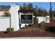 Attractive brick signage at The Preserve at Kitchin Farms entrance, with flower bed and mulched landscape at 9301 Kitchin Farms Way # 433, Wake Forest, NC 27587