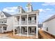 Charming two-story home with a covered porch, perfect for enjoying the outdoors at 9301 Kitchin Farms Way # 433, Wake Forest, NC 27587