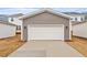 Spacious detached two-car garage with a white door and gray siding for ample parking at 9301 Kitchin Farms Way # 433, Wake Forest, NC 27587