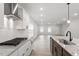 Modern kitchen with stainless steel appliances, granite countertops, and an island with a sink at 9301 Kitchin Farms Way # 433, Wake Forest, NC 27587