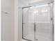 Modern bathroom shower with clear glass door and chrome fixtures at 9301 Kitchin Farms Way # 433, Wake Forest, NC 27587