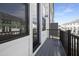 View of balcony featuring black railings and wood decking at 320 Church St, Morrisville, NC 27560