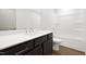 Modern bathroom features a single sink vanity with a soaking tub at 320 Church St, Morrisville, NC 27560