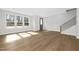 Inviting living room filled with natural light from large windows and stylish hardwood flooring at 320 Church St, Morrisville, NC 27560