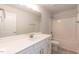 Well-lit bathroom features white vanity, large mirror, and shower-tub combo at 157 Newport Landing # 95, Garner, NC 27529