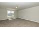 Spacious bedroom with carpet, window, and natural light at 157 Newport Landing # 95, Garner, NC 27529