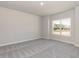 Neutral bedroom with carpeting, large window and natural light at 157 Newport Landing # 95, Garner, NC 27529