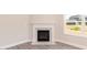 Cozy fireplace with white mantle and marble hearth, adjacent to a large sunny window at 157 Newport Landing # 95, Garner, NC 27529