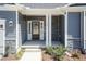 Inviting front entry with stone accents and glass front door for a modern appeal at 157 Newport Landing # 95, Garner, NC 27529