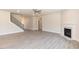 Large living room with fireplace, stairs and hardwood floors offers ample room to relax at 157 Newport Landing # 95, Garner, NC 27529