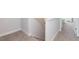 Carpeted staircase with white banister and trim detail at 157 Newport Landing # 95, Garner, NC 27529