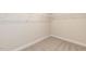 Spacious walk-in closet with carpet and ample shelving for organizing clothes at 157 Newport Landing # 95, Garner, NC 27529
