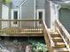 Outdoor space featuring a wooden deck, stairs, railing, and a view to the backyard at 1432 Quarter Pt, Raleigh, NC 27615