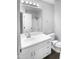 Bathroom with a large mirror, ample cabinet space, and updated fixtures at 1432 Quarter Pt, Raleigh, NC 27615