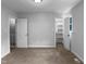 Bedroom with carpet flooring and doors to an ensuite bathroom and a walk-in closet at 1432 Quarter Pt, Raleigh, NC 27615